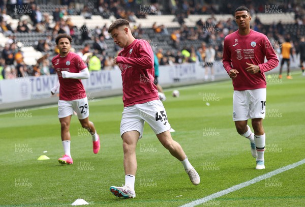 290423 - Hull City v Swansea City - Sky Bet Championship - Warm up before the match Cameron Congreve of Swansea and Matthew Sorinola  of Swansea and Morgan Whittaker of Swansea