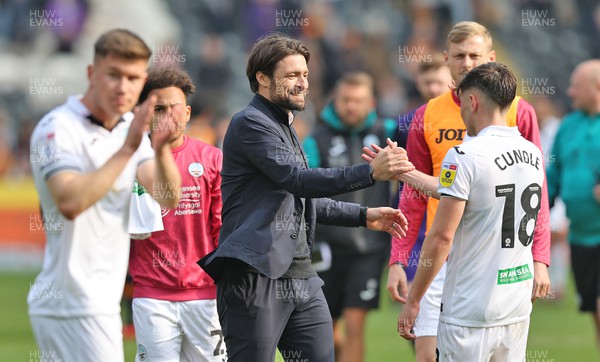 290423 - Hull City v Swansea City - Sky Bet Championship - Head Coach Russell Martin  of Swansea congratulates goalscorer Luke Cundle of Swansea at the end of the match