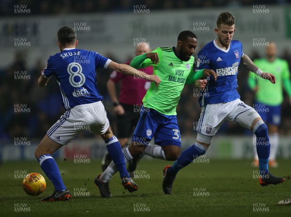 210218 - Ipswich Town v Cardiff City, Sky Bet Championship - Junior Hoilett of Cardiff City is tackled by Cole Skuse of Ipswich Town