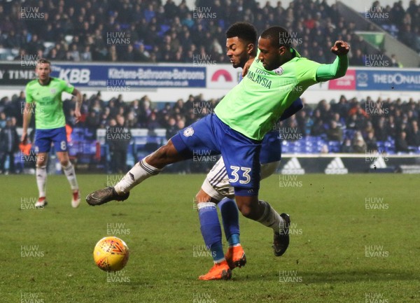 210218 - Ipswich Town v Cardiff City, Sky Bet Championship - Junior Hoilett of Cardiff City compete for the ball with Grant Ward of Ipswich Town