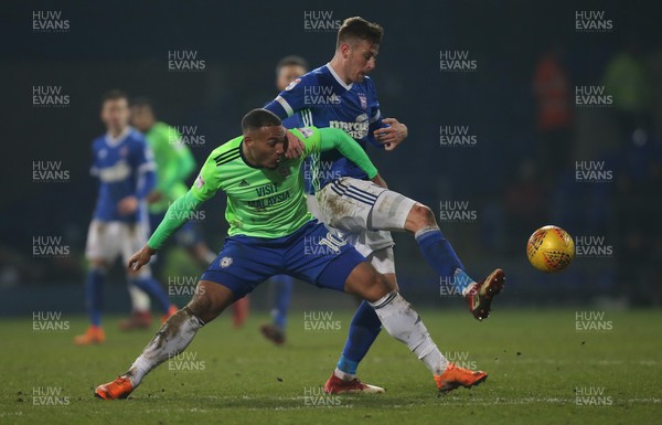 210218 - Ipswich Town v Cardiff City, Sky Bet Championship - Kenneth Zohore of Cardiff City and Adam Webster of Ipswich Town compete for the ball