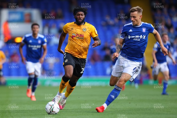 100821 - Ipswich Town v Newport County - Carabao Cup - Jordan Greenidge of Newport County competes for the ball with Luke Woolfenden of Ipswich Town