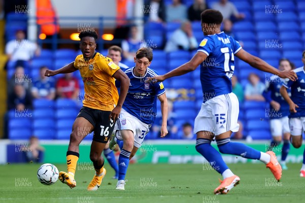 100821 - Ipswich Town v Newport County - Carabao Cup - Timmy Abraham of Newport County passes the ball round Corrie Ndaba of Ipswich Town