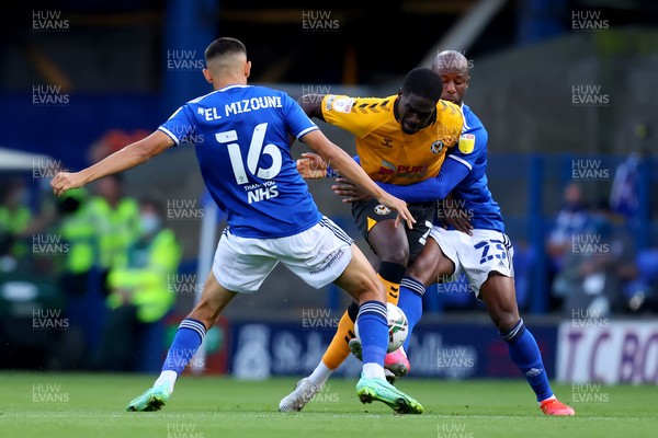 100821 - Ipswich Town v Newport County - Carabao Cup - Christopher Missilou of Newport County is challenged by Idris El Mizouni and Sone Aluko of Ipswich Town