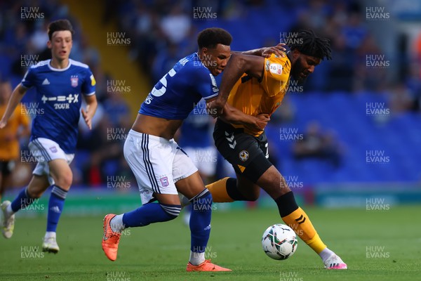 100821 - Ipswich Town v Newport County - Carabao Cup - Jordan Greenidge of Newport County competes for the ball with Corrie Ndaba of Ipswich Town