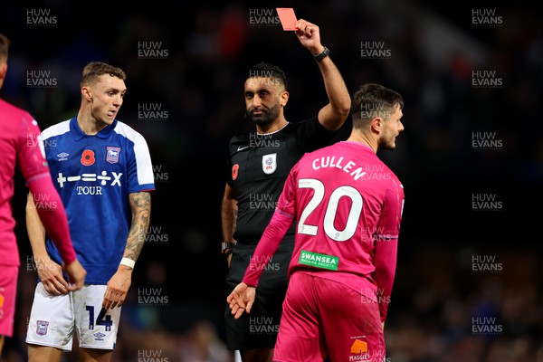 111123 - Ipswich Town v Swansea City - Sky Bet Championship - Referee Sunny Sukhvir Gill shows Liam Cullen of Swansea City a red card
