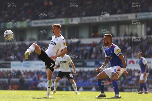 220419 - Ipswich Town v Swansea City - Sky Bet Championship - Jay Fulton of Swansea City controls the ball ahead of Luke Chambers of Ipswich Town