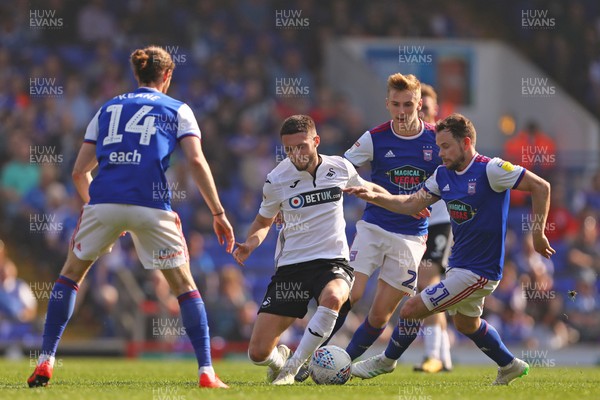 220419 - Ipswich Town v Swansea City - Sky Bet Championship - Matt Grimes of Swansea City battles with Alan Judge after beating Flynn Downes of Ipswich Town