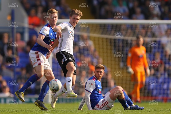 220419 - Ipswich Town v Swansea City - Sky Bet Championship - George Byers of Swansea City gets between Flynn Downes and Teddy Bishop of Ipswich Town