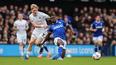 280226 - Ipswich Town v Swansea City - Sky Bet Championship - Melker Widell of Swansea City and Azor Matusiwa of Ipswich Town 