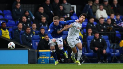 280226 - Ipswich Town v Swansea City - Sky Bet Championship - Leif Davis of Ipswich Town and Eom Ji-Sung of Swansea City 