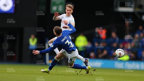280226 - Ipswich Town v Swansea City - Sky Bet Championship - Ethan Galbraith of Swansea City and Leif Davis of Ipswich Town 