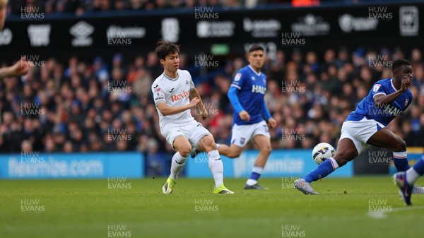 280226 - Ipswich Town v Swansea City - Sky Bet Championship - Eom Ji-Sung of Swansea City had his shot blocked by Cedric Kipre of Ipswich Town 