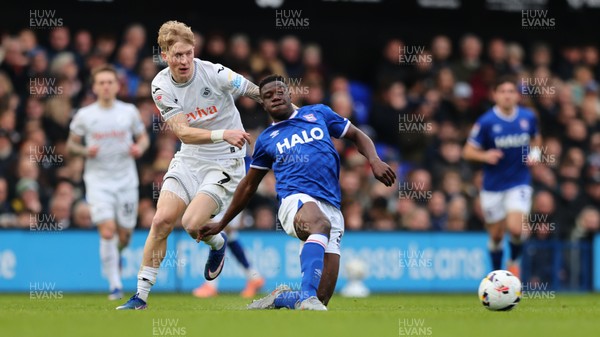 280226 - Ipswich Town v Swansea City - Sky Bet Championship - Melker Widell of Swansea City and Azor Matusiwa of Ipswich Town 