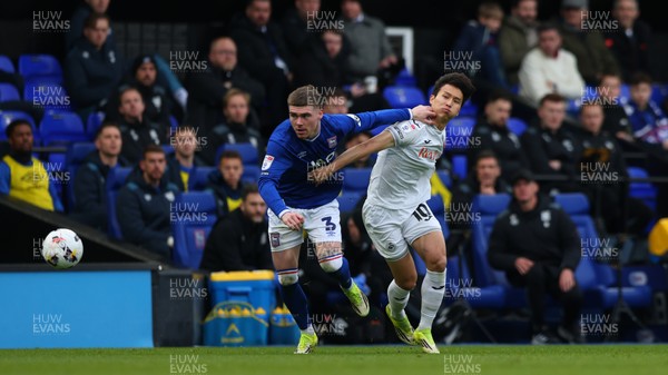 280226 - Ipswich Town v Swansea City - Sky Bet Championship - Leif Davis of Ipswich Town and Eom Ji-Sung of Swansea City 