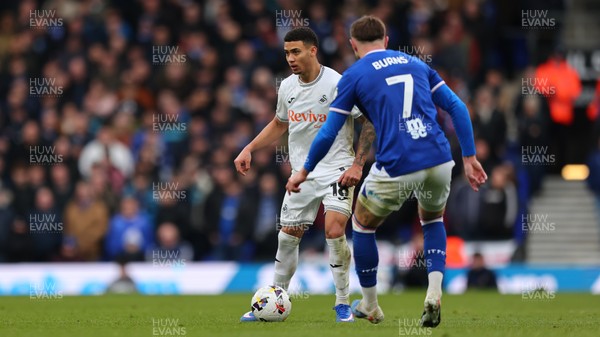 280226 - Ipswich Town v Swansea City - Sky Bet Championship - Gustavo Nunes of Swansea City and Wes Burns of Ipswich Town 