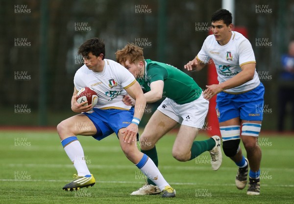 310318 - Ireland U18 v Italy U18, U18s Six Nations Festival, Ystrad Mynach - Matteo Moscardi of Italy is tackled by Karl Martin of Ireland