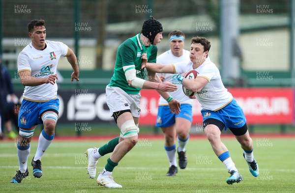 310318 - Ireland U18 v Italy U18, U18s Six Nations Festival, Ystrad Mynach - Paolo Garbisi of Italy takes on Tom Ahern of Ireland