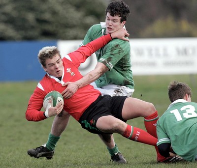 250206 Ireland U19 v Wales U19 -  Ian Whitten and Kyle Tonnetti of Ireland and Gareth Maule of Wales 