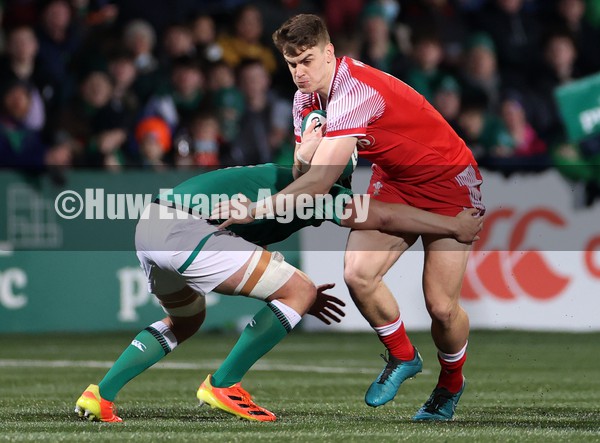 040222 - Ireland U20s v Wales U20s - U20s Six Nations Championship - Bryn Bradley of Wales is tackled by Reuben Crothers of Ireland