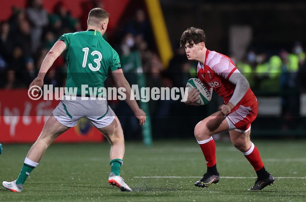 040222 - Ireland U20s v Wales U20s - U20s Six Nations Championship - Eddie James of Wales is challenged by Fionn Gibbons of Ireland