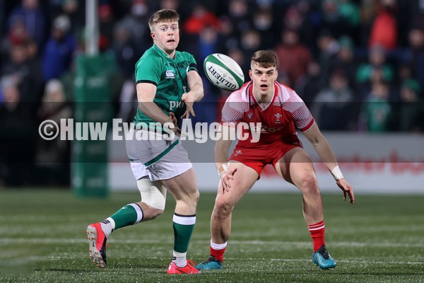 040222 - Ireland U20s v Wales U20s - U20s Six Nations Championship - Patrick Campbell of Ireland is challenged by Bryn Bradley of Wales