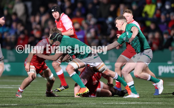 040222 - Ireland U20s v Wales U20s - U20s Six Nations Championship - Reuben Crothers of Ireland is tackled by Alex Mann of Wales