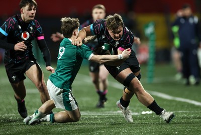 070326 - Ireland U20s v Wales U20s - U20s Six Nations Championship - Dom Kossuth of Wales is tackled by Christopher Barrett of Ireland e
