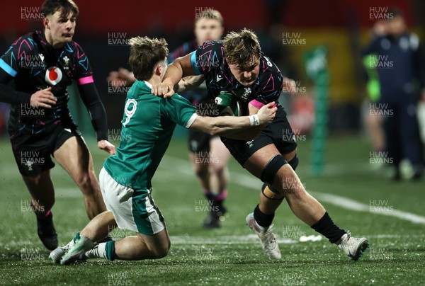 070326 - Ireland U20s v Wales U20s - U20s Six Nations Championship - Dom Kossuth of Wales is tackled by Christopher Barrett of Ireland e