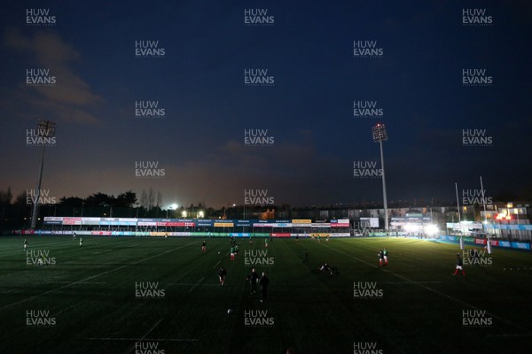 230218 - Ireland U20s v Wales U20s - Natwest 6 Nations - Picture shows Wales warming up in the dark as the flood lights go out