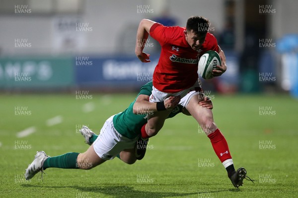 230218 - Ireland U20s v Wales U20s - Natwest 6 Nations - Tommy Rogers of Wales is tackled by Tommy O'Brien of Ireland