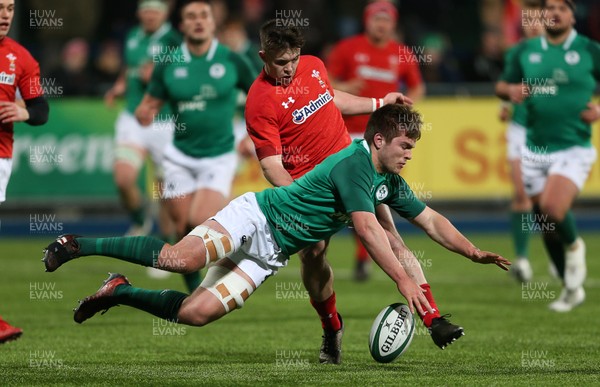230218 - Ireland U20s v Wales U20s - Natwest 6 Nations - Callum Carson of Wales and Matthew Agnew of Ireland compete for the ball