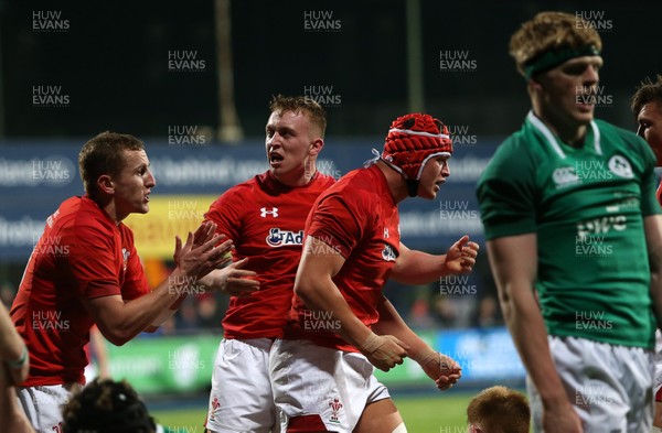230218 - Ireland U20s v Wales U20s - Natwest 6 Nations - James Botham of Wales celebrates scoring a try with Tommy Reffell