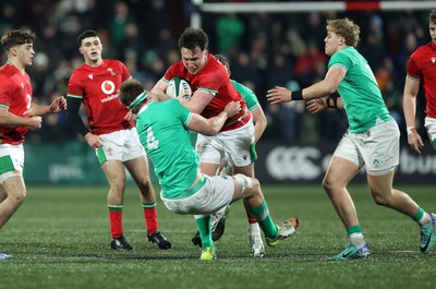 230224 - Ireland U20s v Wales U20s - U20s 6 Nations Championship - Harri Ackerman of Wales is tackled by Joe Hopes of Ireland 