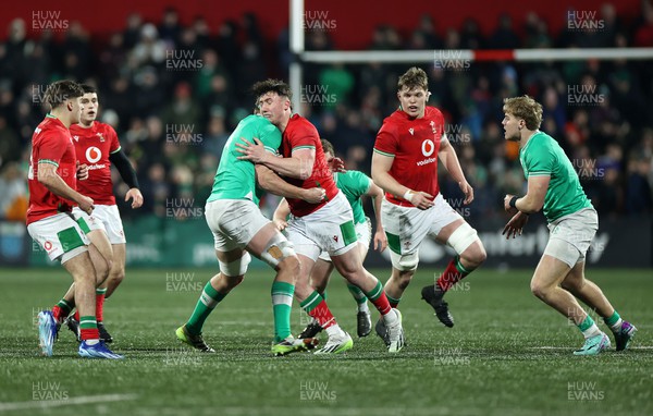 230224 - Ireland U20s v Wales U20s - U20s 6 Nations Championship - Harri Ackerman of Wales is tackled by Joe Hopes of Ireland 