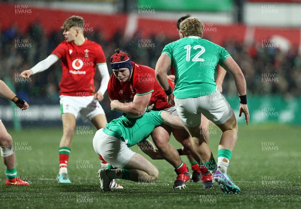 230224 - Ireland U20s v Wales U20s - U20s 6 Nations Championship - Josh Morse of Wales is tackled by Wilhelm de Klerk of Ireland 
