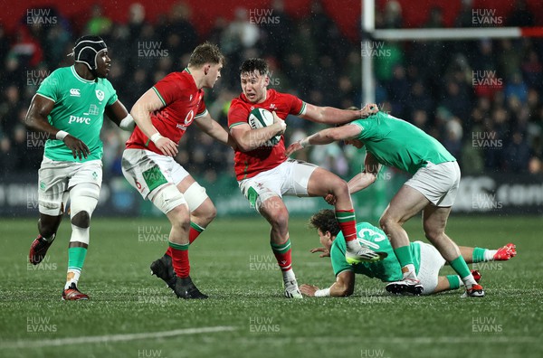 230224 - Ireland U20s v Wales U20s - U20s 6 Nations Championship - Harri Ackerman of Wales gets past Wilhelm de Klerk of Ireland 