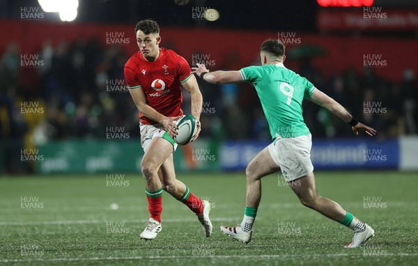 230224 - Ireland U20s v Wales U20s - U20s 6 Nations Championship - Louie Hennessey of Wales is challenged by Oliver Coffey of Ireland 