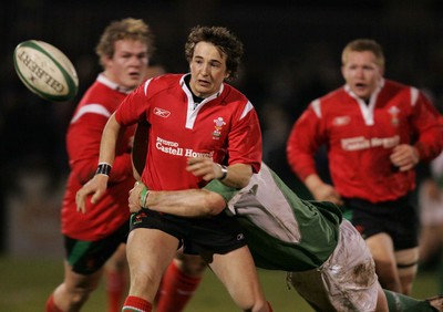 240206 - Ireland U21 v Wales U21 - Martin Roberts of Wales is tackled by Sean O'Brien of Ireland 