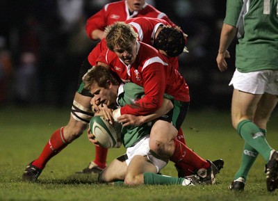 240206 - Ireland U21 v Wales U21 - Paul Marshall of Ireland is tackled by Rhys Gill of Wales 