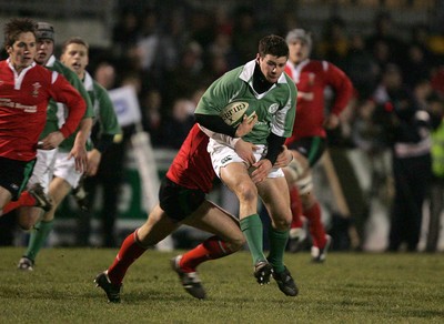 240206 - Ireland U21 v Wales U21 - Fergus McFadden of Ireland is tackled by Jamie Roberts of Wales  