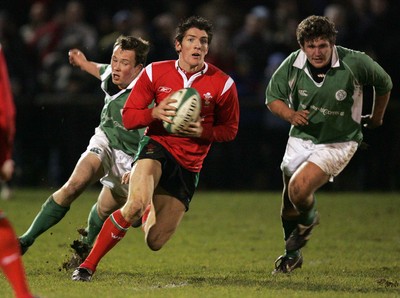 240206 - Ireland U21 v Wales U21 - James Hook of Wales gets away from Conan Doyle and Stuart Philpot of Ireland 