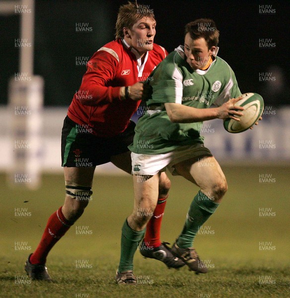 240206 - Ireland U21 v Wales U21 - Conan Doyle of Ireland is tackled by Craig Everett  of Wales 