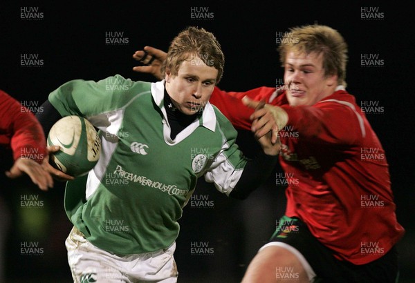 240206 - Ireland U21 v Wales U21 - Fionn Carr of Ireland gets away from Rhys Gill of Wales 