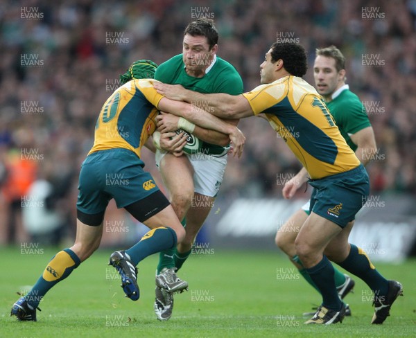 15.11.09 Ireland v Australia... Ireland's David Wallace tackled by Matt Giteau and Digby Ioane. 