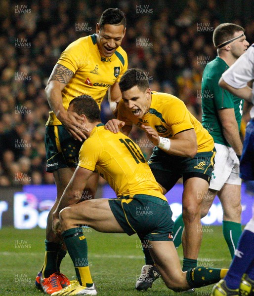 16/11/13 - Ireland v Australia - Guiness SeriesQuade Cooper is congratulated by  team mates Matt Toomua and Israel Folau on scoring the third try for Australia (c) Huw Evans Picture Agency