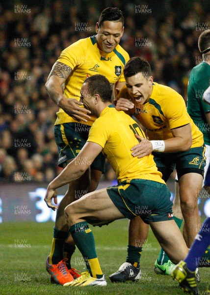 16/11/13 - Ireland v Australia - Guiness SeriesQuade Cooper is congratulated by  team mates Matt Toomua and Israel Folau on scoring the third try for Australia (c) Huw Evans Picture Agency