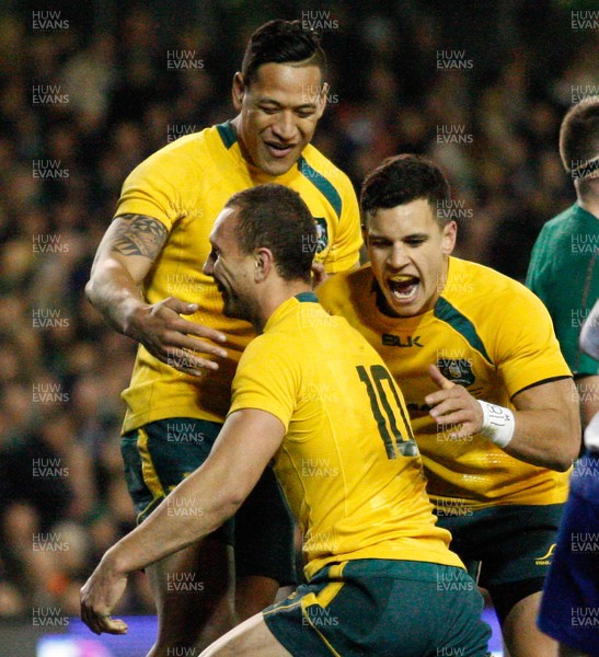 16/11/13 - Ireland v Australia - Guiness SeriesQuade Cooper is congratulated by  team mates Matt Toomua and Israel Folau on scoring the third try for Australia (c) Huw Evans Picture Agency