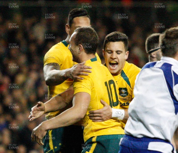 16/11/13 - Ireland v Australia - Guiness SeriesQuade Cooper is congratulated by  team mates Matt Toomua and Israel Folau on scoring the third try for Australia (c) Huw Evans Picture Agency