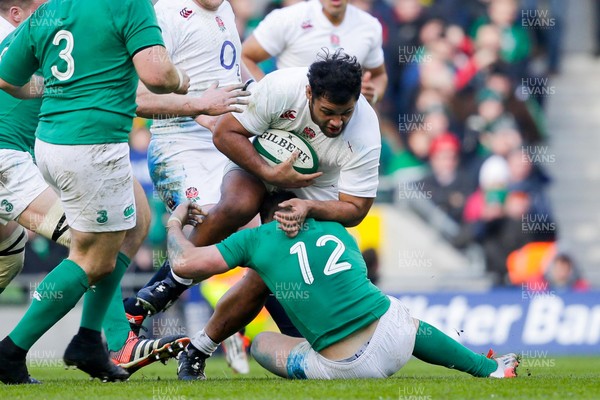 010315 - Ireland v England - RBS 6 Nations - Billy Vunipola of England is tackled by Robbie Henshaw of Ireland